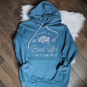 Living My Best Life in Wyoming Hooded Sweatshirt in Heather Teal