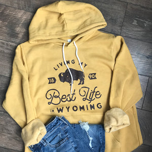Living My Best Life in Wyoming Hooded Sweatshirt in Heather Mustard